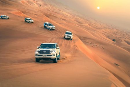 Dubai desert safari with dune bashing, sand boarding, BBQ dinner