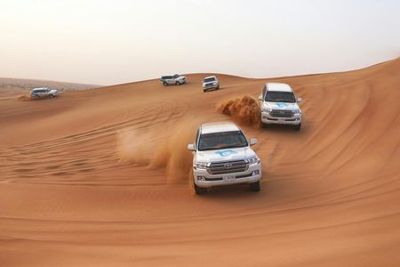 Dubai morning desert safari with dune bashing, sandboarding, camel ride