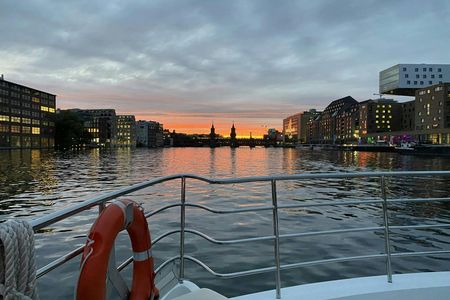 Solar-powered catamaran cruise on Berlin's Spree River at sunset