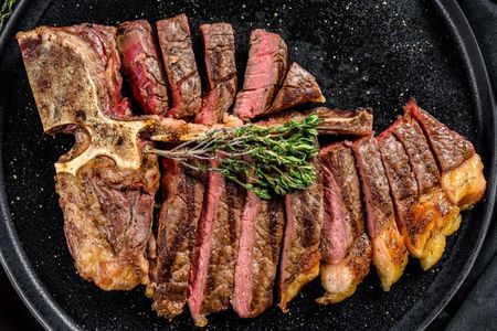 Florentine-style steak cooking experience with a chef and unlimited wine