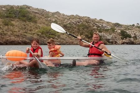 Guided transparent kayak tour in the bay of Addaia in Menorca