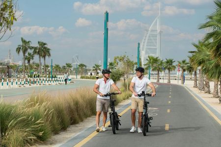 Dubai e-bike journey with old town, beachside and desert tour options