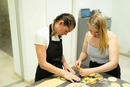 Fresh pasta and tiramisù cooking class with wine pairing in Milan
