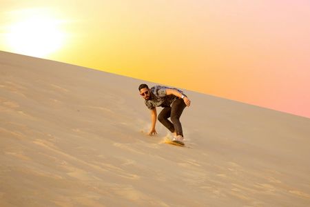 Abu Dhabi sunrise desert adventure with dune bashing and camel ride