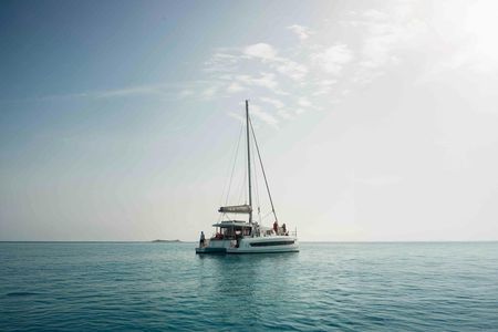Sardinian coastline catamaran tour with multiple stops