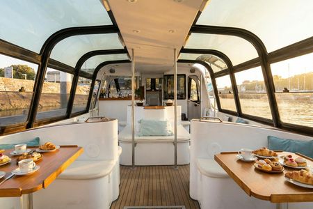 Private sunrise cruise with coffee and pastries in Lisbon