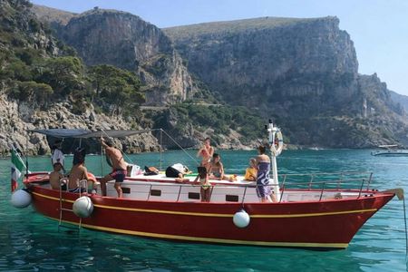 Gozzo boat tour in Naples with swimming stop and local tasting