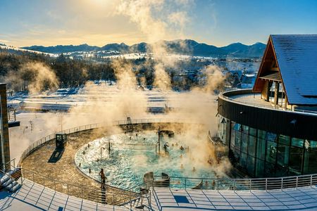 Snowmobile or quad ride and thermal pools day trip from Zakopane