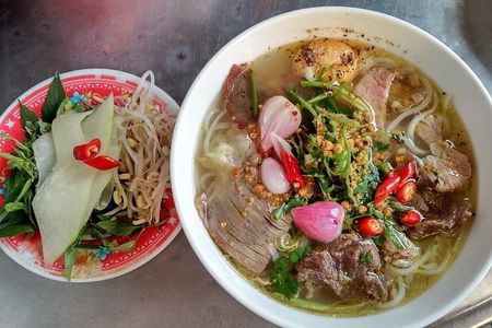 Cooking class, market tour and basket boat tour