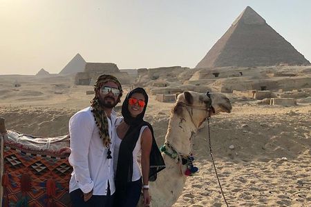 Cairo layover tour Giza pyramids Egyptian museum local bazaars Camel ride Lunch