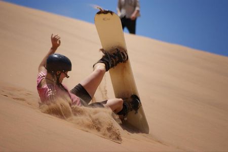 Private Desert Sandboarding Camel riding tour
