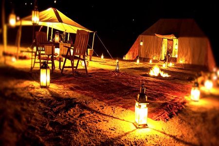 Overnight Desert Safari with Dune Bashing, Belly Dance, Camel Ride and Breakfast