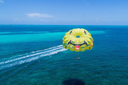 Fly Above Cancun Bay: Parasailing Experience
