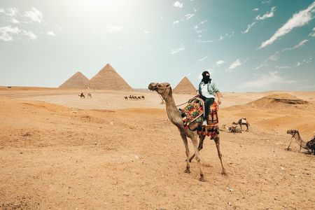 Camel Ride at Giza Pyramids during sunset
