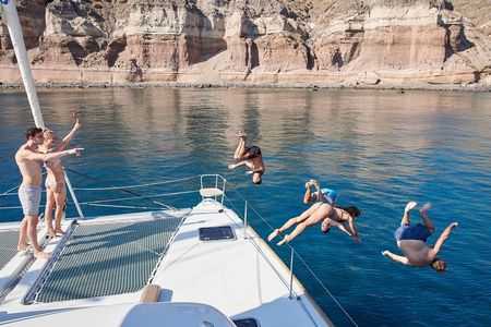 Santorini Gold Catamaran Cruise with BBQ, Drinks and Hotel Pickup