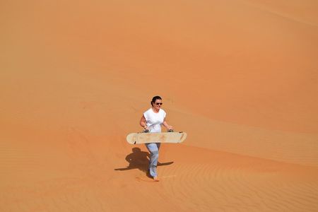 Exclusive Sunrise Desert Safari with Camel Ride Sand Boarding Dune Bashing
