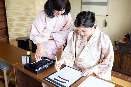 Calligraphy experience with simple kimono in Okinawa