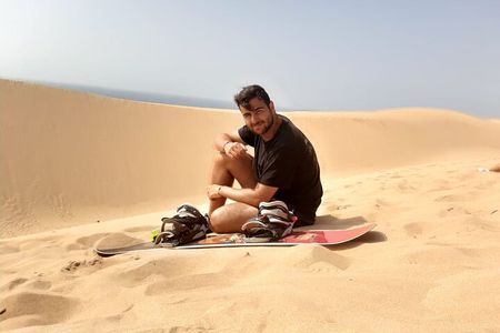 Experience the sandboarding and painted village half day