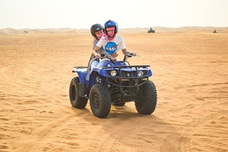 Evening Desert Safari with Quad Bike, BBQ Dinner and Camel Ride