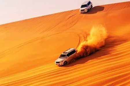 Sunset Red Dune Evening Safari, Camel ride, shows & BBQ Dinner