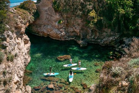 Small group paddle boarding tour to Bagni Regina Giovanna 