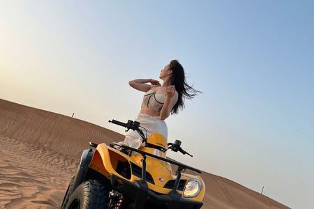 Dubai Desert Safari with Quad Bike, sandboarding, live show & BBQ