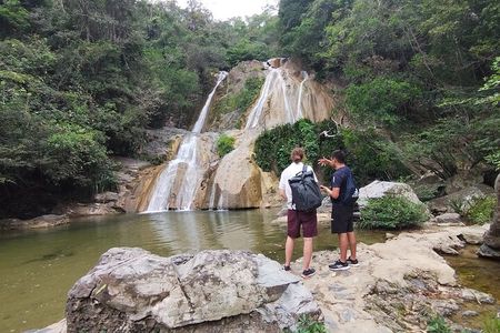 Natural adventure with waterfalls, trails and sunny day