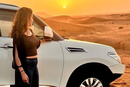 Evening Desert Safari with BBQ Dinner, Sandboarding and Camel Ride Experience