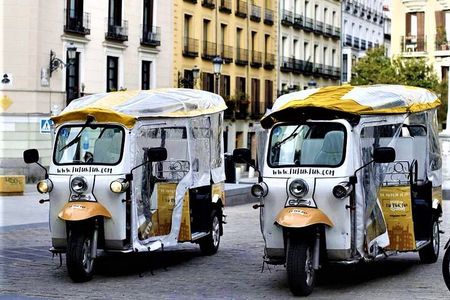 Tour of Historic and Modern Madrid with a guide in a yellow tuk tuk