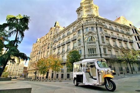 Tour of Historic and Modern Madrid with a guide in a yellow tuk tuk