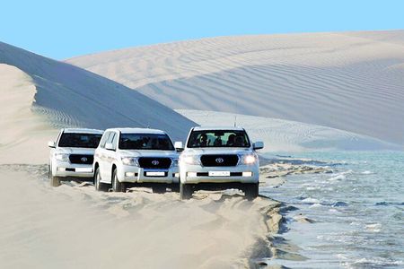 From Doha Airport: Desert safari and Inland Sea Tour.