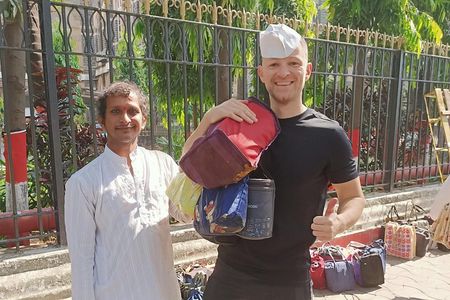 Dabbawala, Dhobi Ghat & Dharavi slum Tour with Local Train Ride