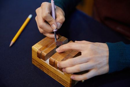Carving a Korean Stone Seal with Jeongju in Insadong Seoul.