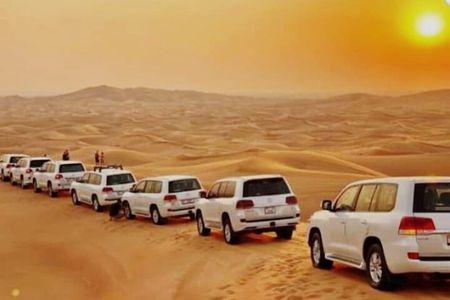Dubai Desert Safari with Camel Ride, Sand surf, & BBQ Dinner