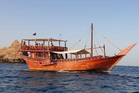 Omani Traditional Dhow Cruise: Sunset and Muscat Coastal View