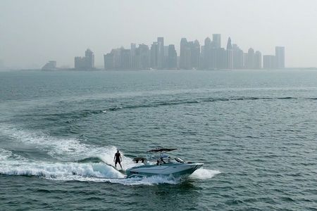Private Wakesurfing or Wakeboarding along Doha's skyline