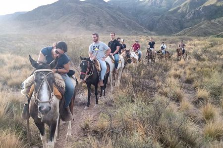 Horseback riding at sunset