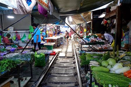 Meet Thai locals and tour Maeklong Railway Market with lunch