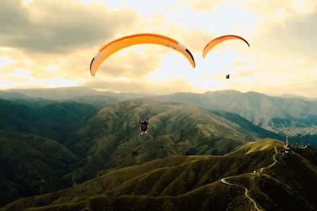 Paragliding free flight experience over the pre-range