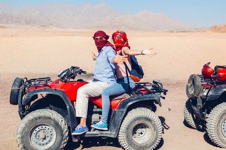 Ride into the Sunset Quad Biking Desert Safari Experience