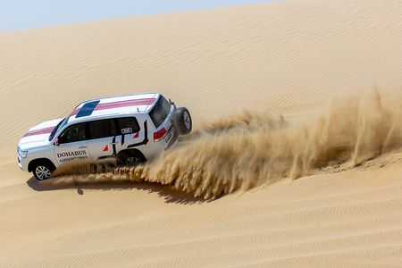 Full-day Qatar desert safari: dune bashing, sandboarding, camels