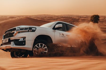 Deluxe Sunset Desert Safari: SandSurfing, Camel Ride & BBQ dinner