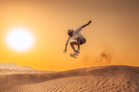 Private Sunset Desert Safari:SandSurfing, Camel Ride & BBQ dinner