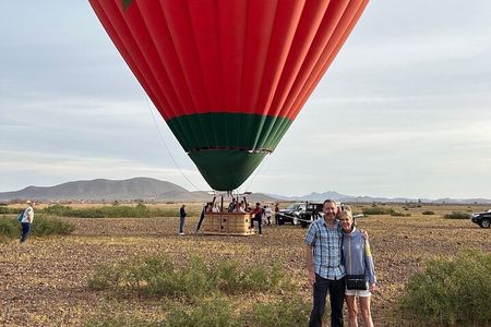 Hot air balloon flight in the desert with camel ride