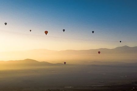 Hot air balloon flight in the desert with camel ride