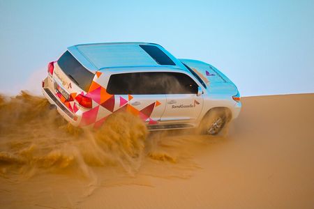 Abu Dhabi Evening Desert Safari - Dune bashing Camel ride and BBQ