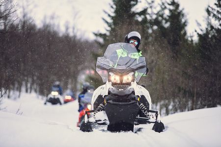 Midday Snowmobiling in Camp Tamok with Guide