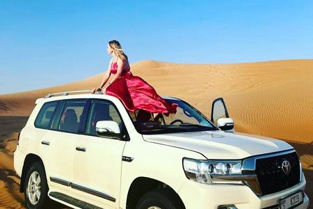 Private Morning Safari Camel Ride, Dune Bashing and Sandboarding