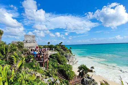 Half-day Tulum ruins and cenote swim arrive before the crowds