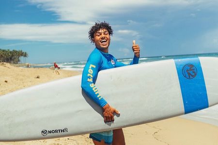 Surfing lesson at beautiful beach Playa Encuentro